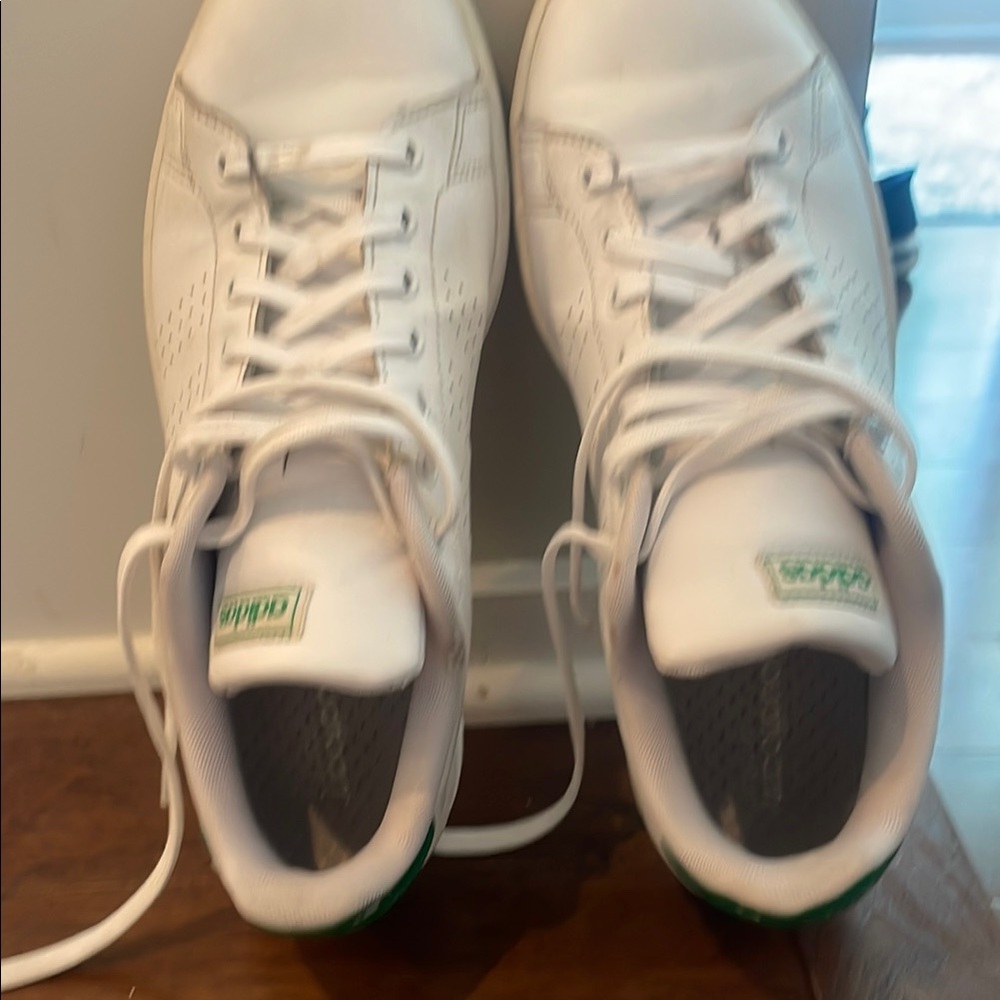 Adidas White and Green Men’s Classic sneaker.